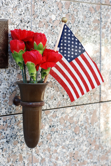 Flowers and American Flag at crypt